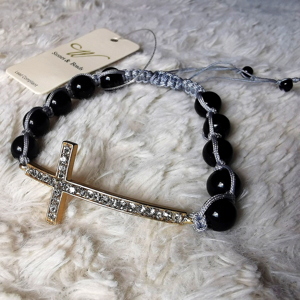 Gold + rhinestones cross w/black beads + gray cord